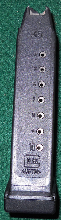 detail, back of Glock 21 mid-'90s 1-round magazine